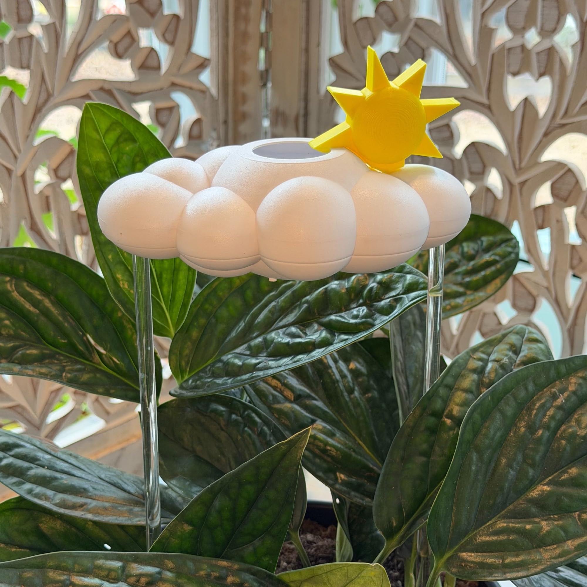 THE CLOUD MAKERS rain cloud resting in plant pot demonstrating fit and beauty