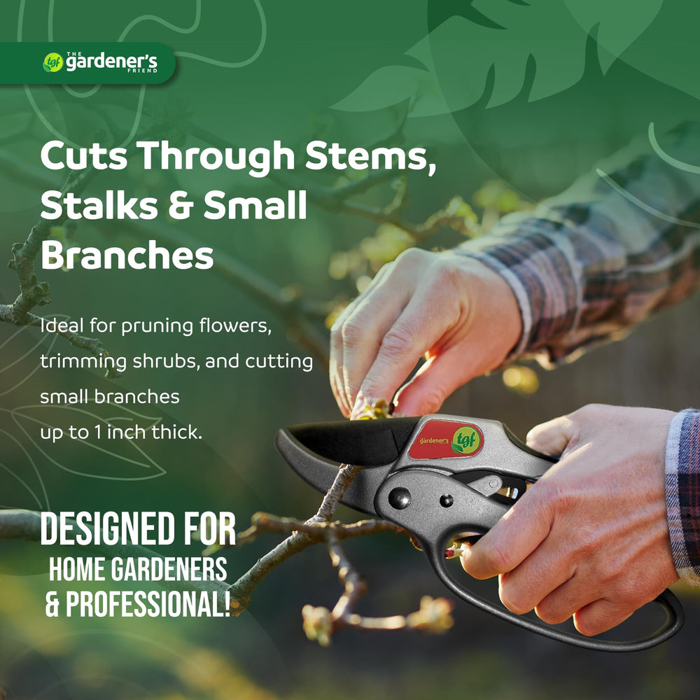 The Gardener's Friend shears in use cutting a small branch to demonstrate leverage and efficiency in the garden