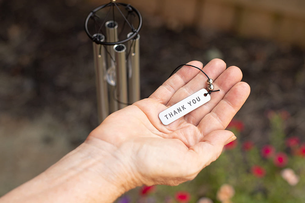 The Grandparent Gift Co. wind chime held in hand for scale to show 22-inch size