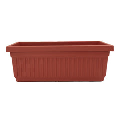 The HC Companies planter front view showing elegant fluted design and clay color