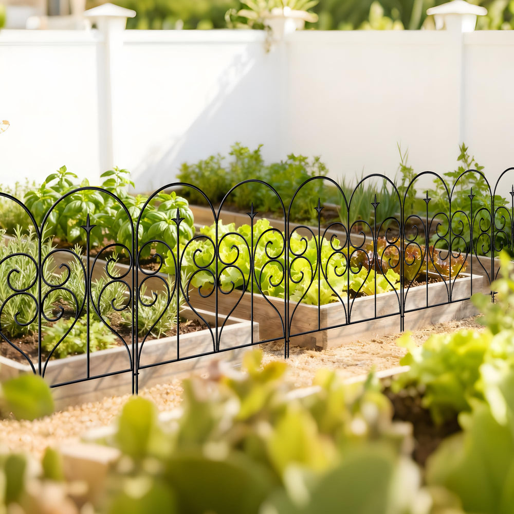 Thealyn fence protecting flowerbed from small pets while keeping plants visible