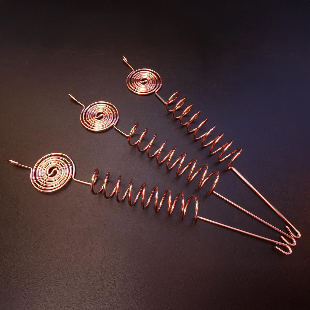 Weathered patina on Thrive Garden copper coil indicating long-term outdoor resilience
