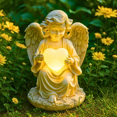 TIALLY front view of angel statue showing peaceful pose and soft glow