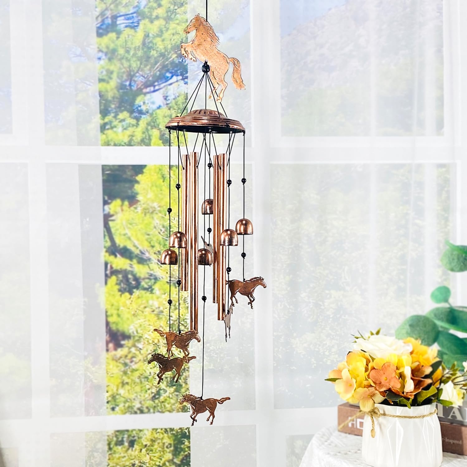 TIGGSY wind chime in garden setting adding charm and soothing outdoor ambiance