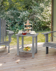 Tikea table in use on patio beside Adirondack chair demonstrating outdoor convenience