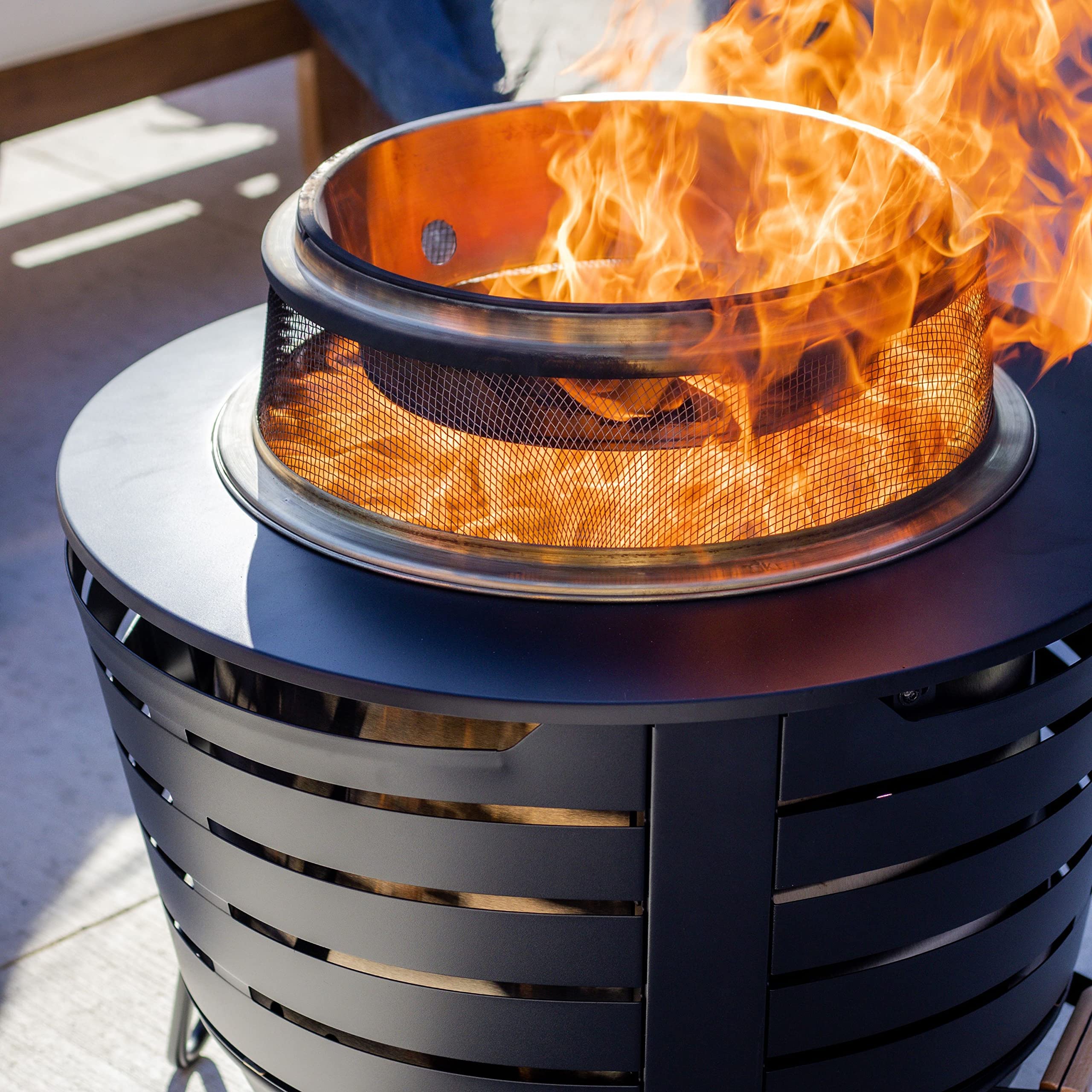 TIKI adding logs through deflector opening, convenient fueling access