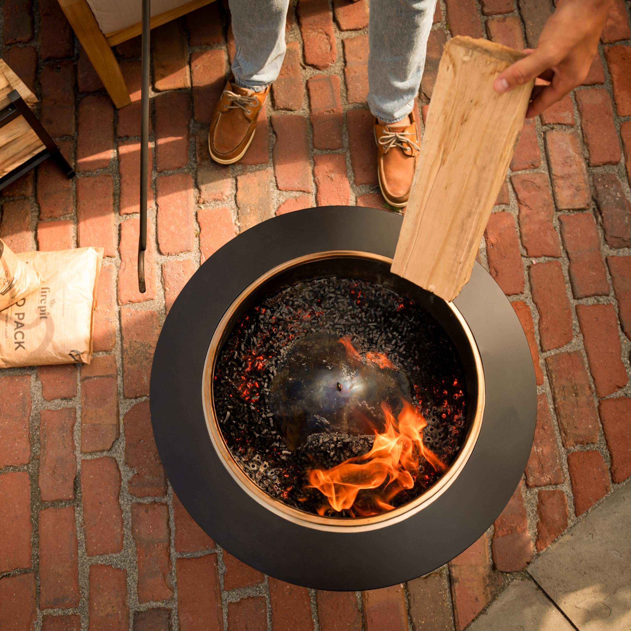 TIKI pellets burning at a campsite creating reliable, low-smoke ambiance