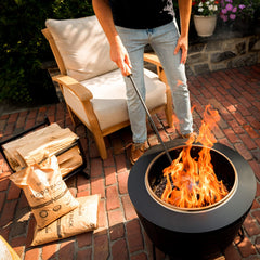 TIKI pellet pack lit inside a smokeless fire pit providing quick warmth