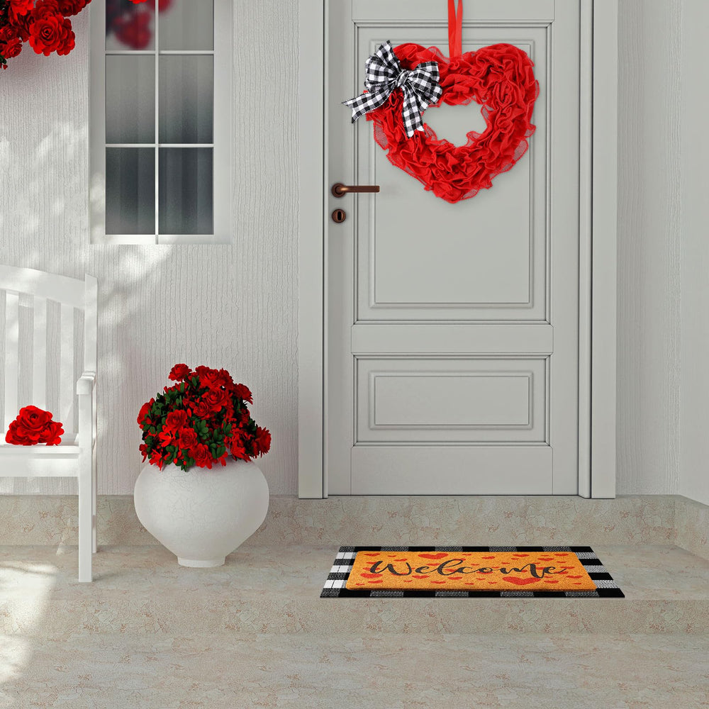 Timgle heart wreath hung on front door showing seasonal curb appeal