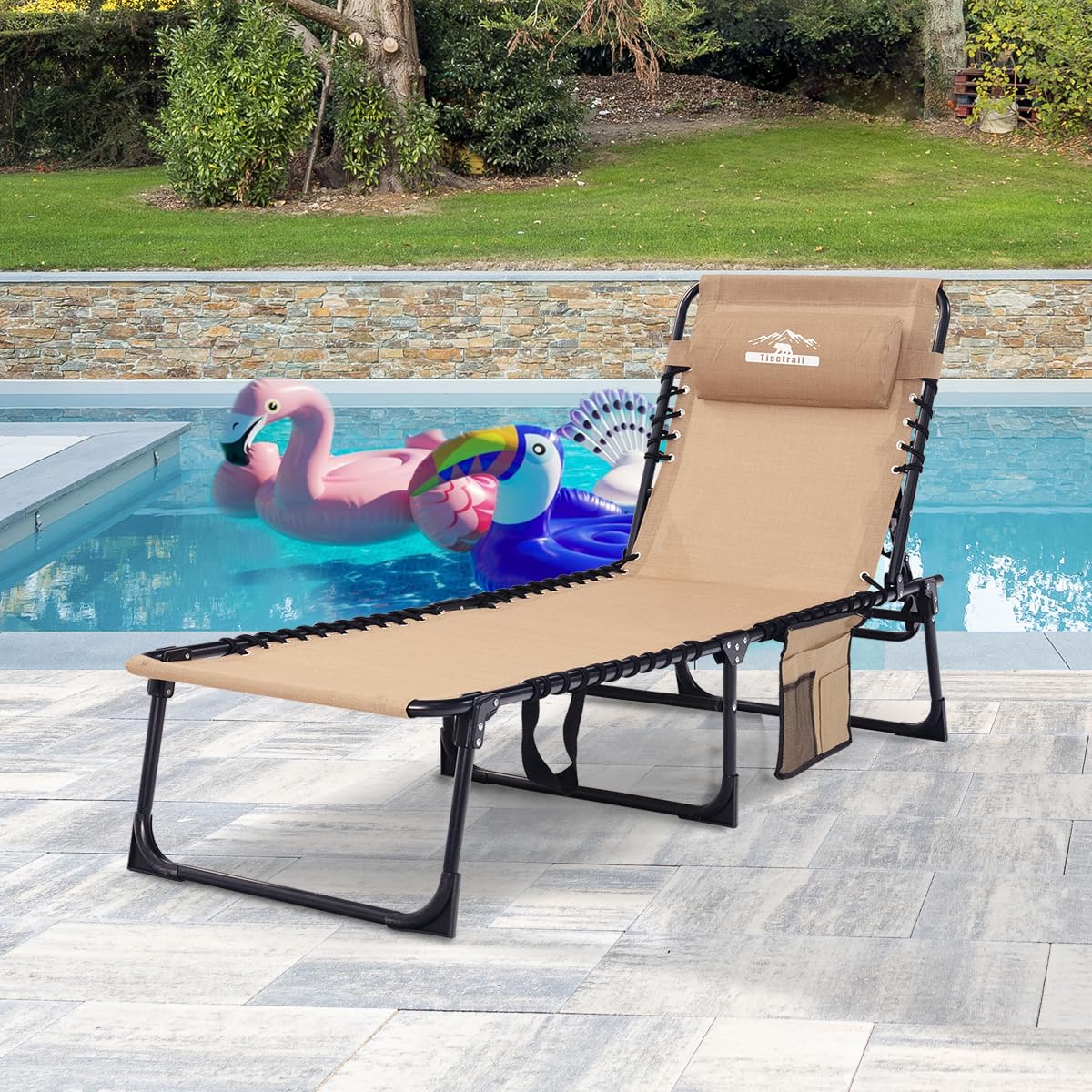 Tisetrail chaise in a garden lifestyle scene demonstrating outdoor durability and relaxation