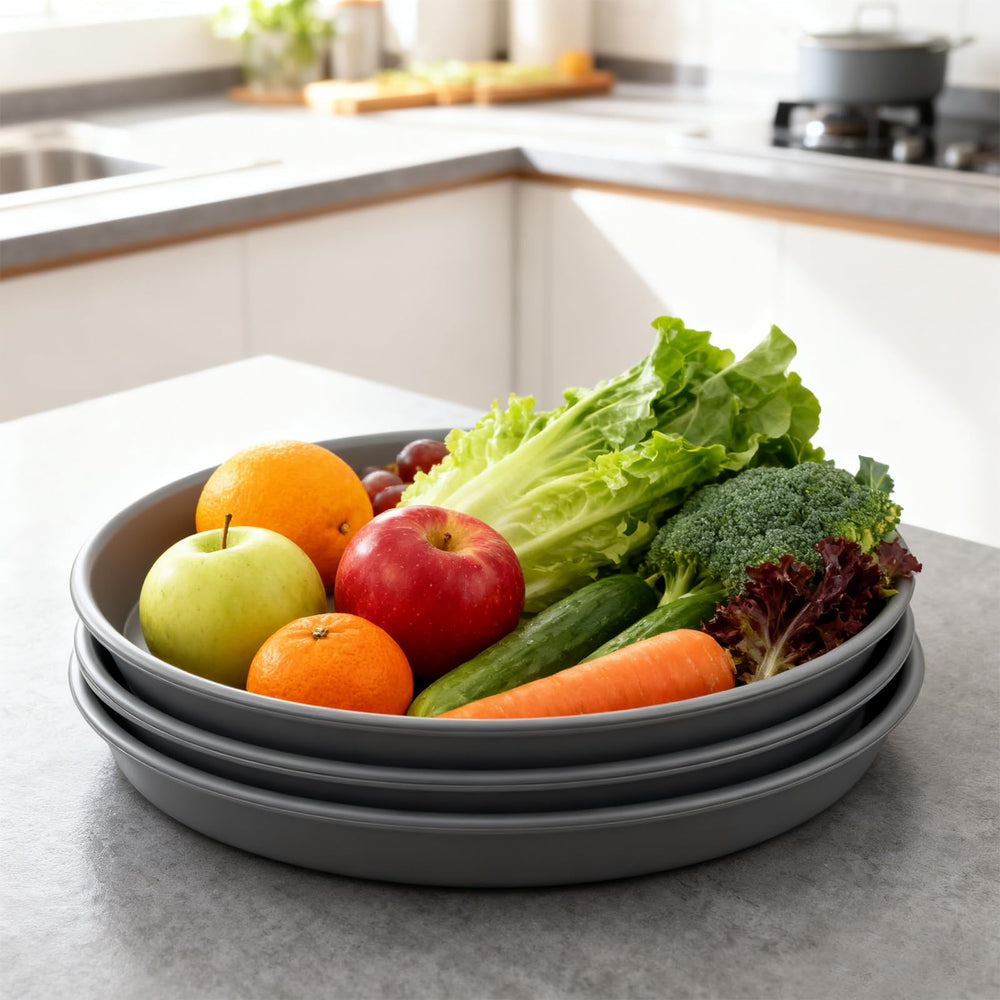 TITE plant saucer in use on patio protecting decking from water and soil stains