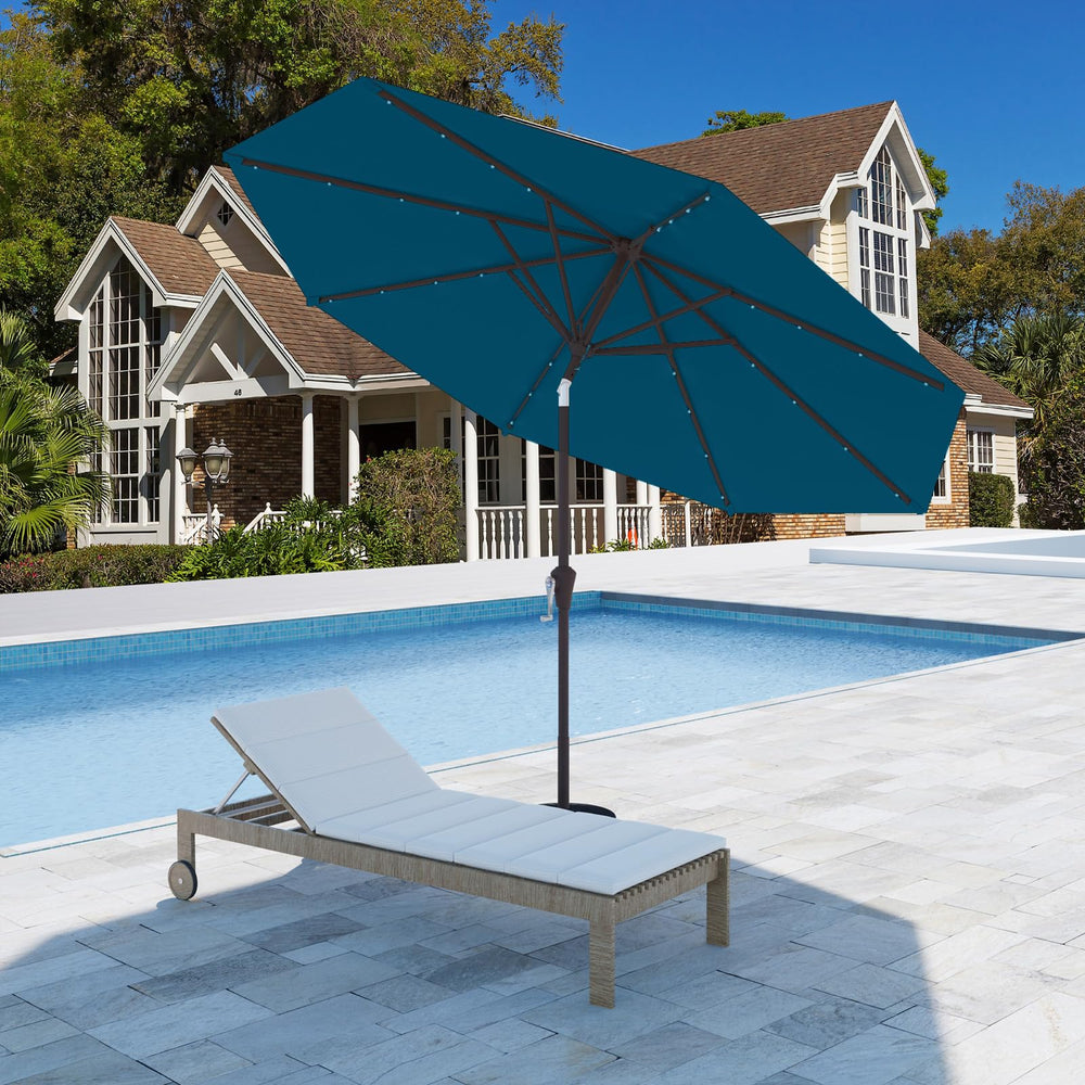 Tobeos lake blue umbrella in backyard at dusk providing ambient light