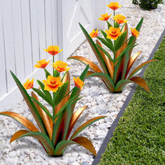 TOMBABY front view of metal agave pair showing bold green finish and daffodils for instant curb appeal