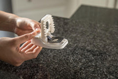 Tomcat trap placed along baseboard in kitchen for discreet effective placement