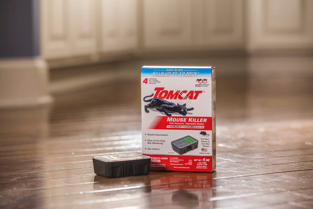Tomcat station in hand for scale to illustrate compact, space-saving size