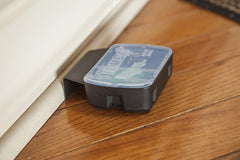 Tomcat station placed along baseboard in kitchen demonstrating discreet, secure placement