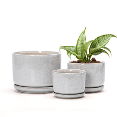 Ton Sin front view of three reactive-glaze white ceramic planters showing sizes and saucers for neat watering