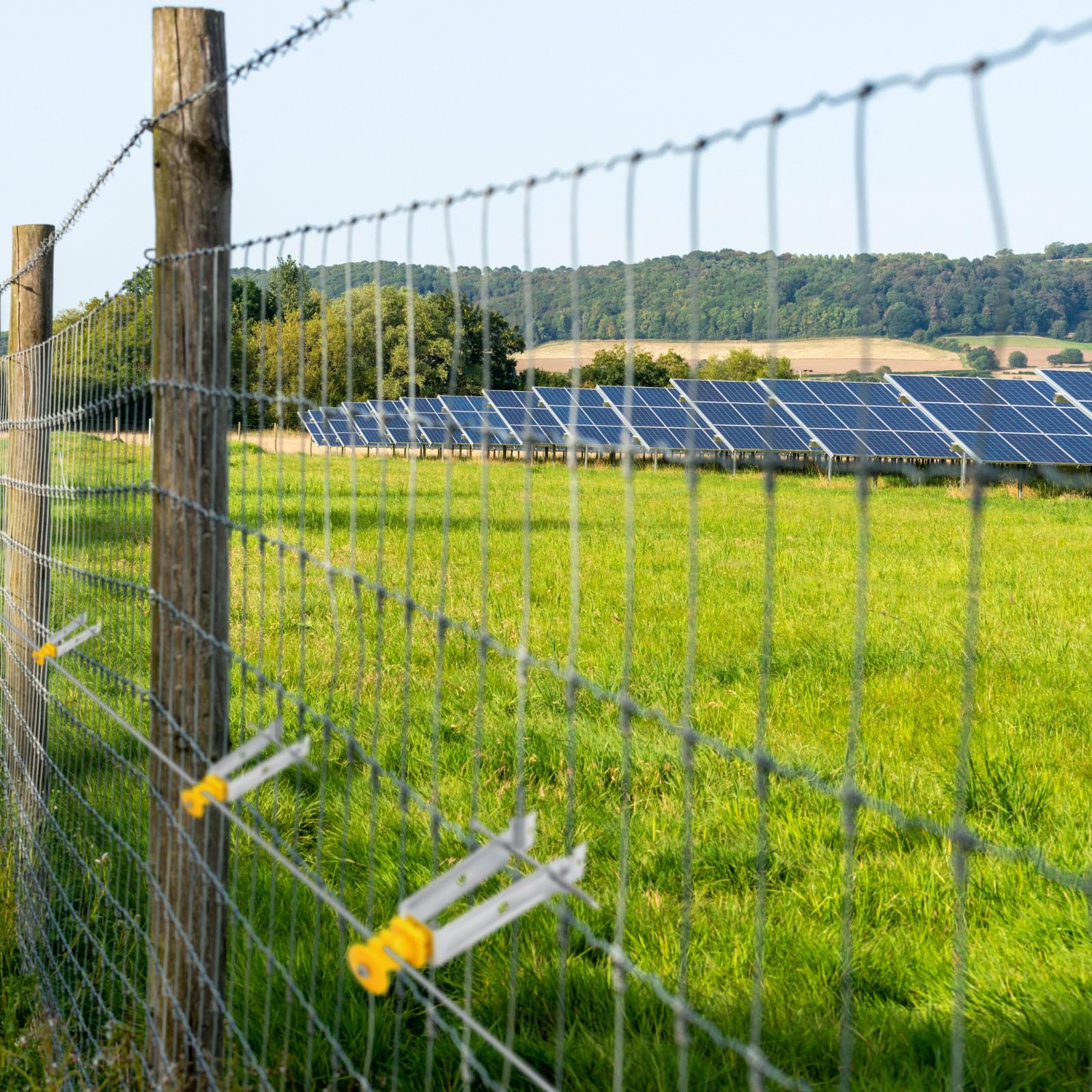 Tondiamo insulators installed on chain link fence keeping wire away from mesh