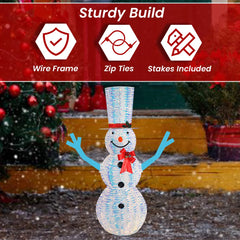Top Treasures snowman lit at dusk creating warm inviting yard glow