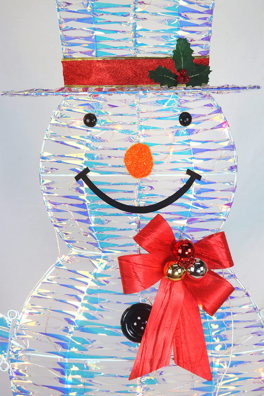 Top Treasures snowman in light snow showing weather-resistant durability