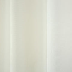 TOWN & COUNTRY BASICS curtain panel hanging on a patio rod creating shaded outdoor living space