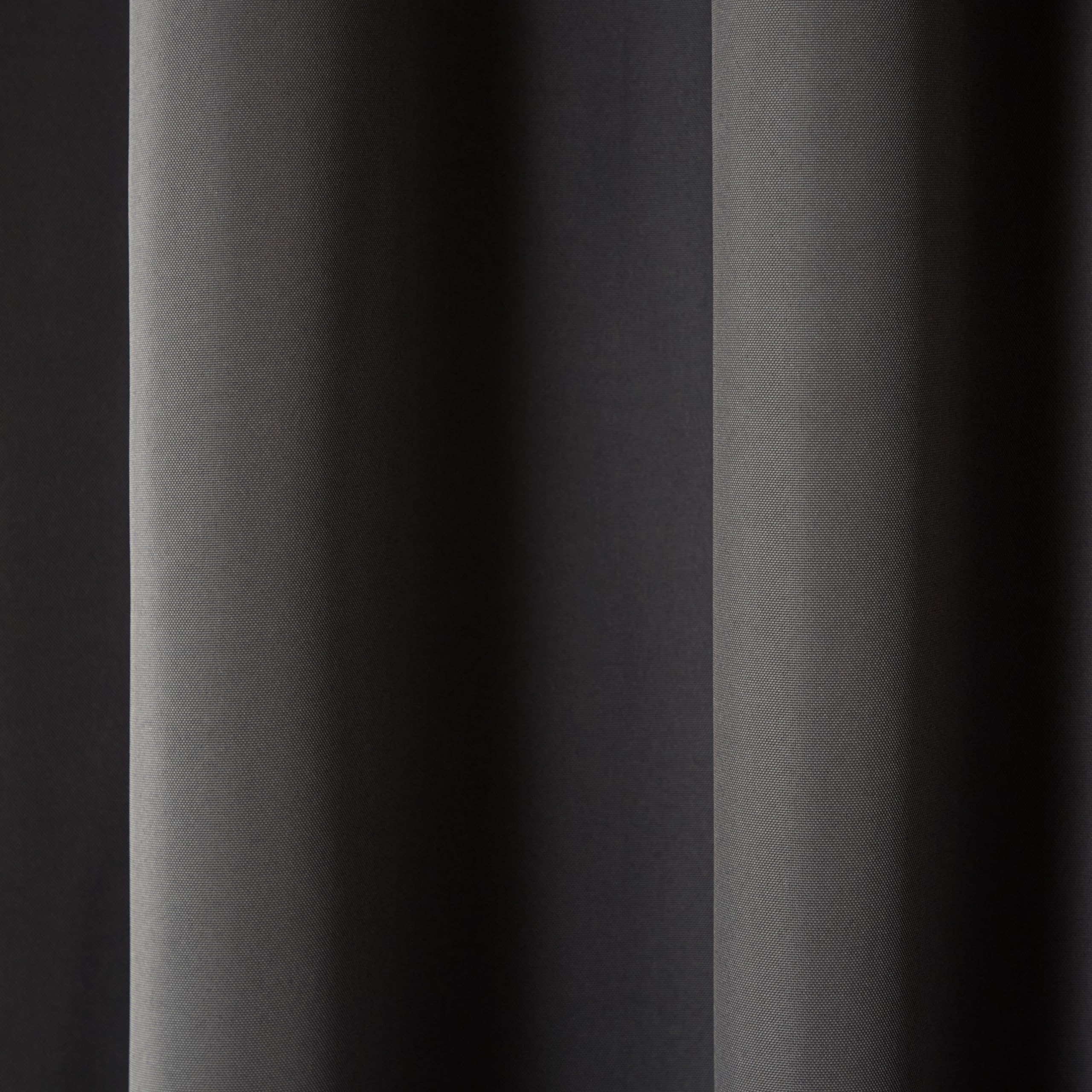 TOWN & COUNTRY BASICS curtains on a patio demonstrating privacy and wind stability outdoors