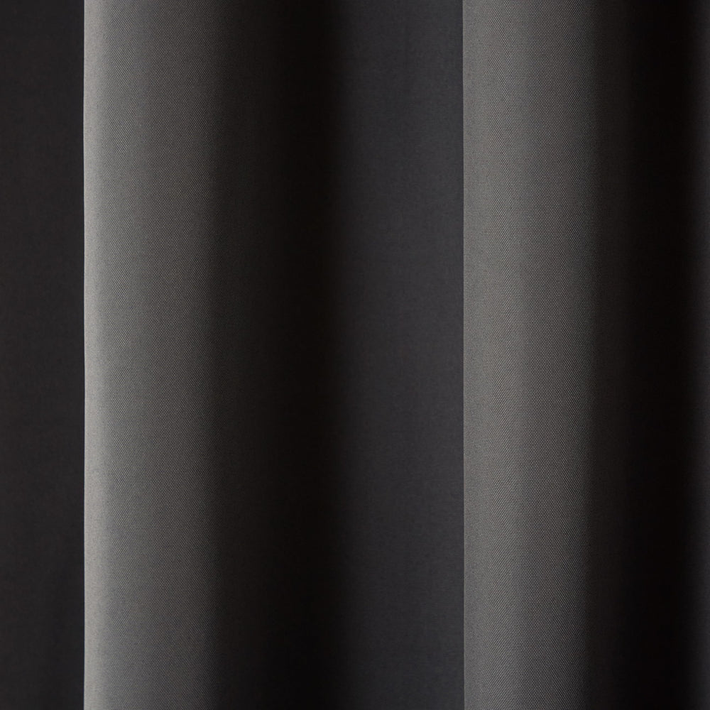 TOWN & COUNTRY BASICS curtains on a patio demonstrating privacy and wind stability outdoors