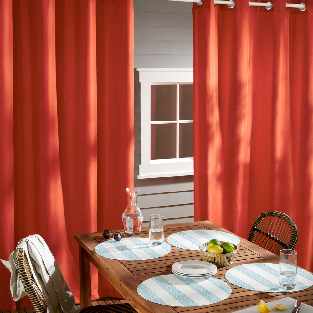 TOWN & COUNTRY BASICS curtain hung on patio creating shaded private outdoor living benefit