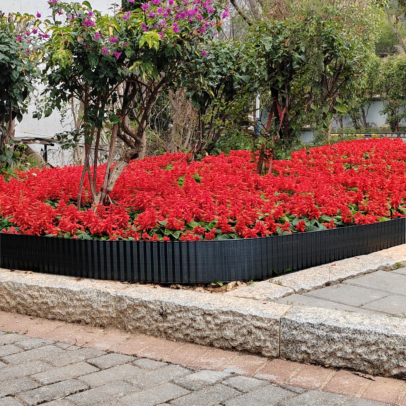 TPNEMGF installed between lawn and flower bed demonstrating containment and neat border benefit