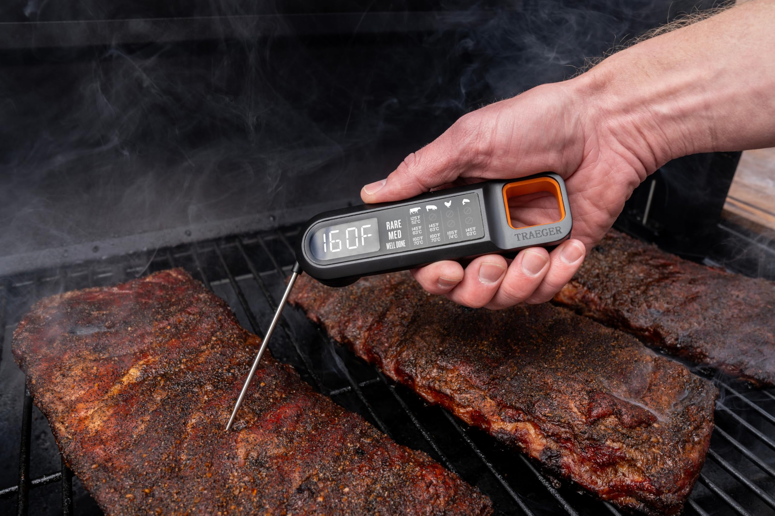 Traeger magnetic back attached to grill for convenient storage and hands-free access