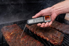 Traeger magnetic back attached to grill for convenient storage and hands-free access