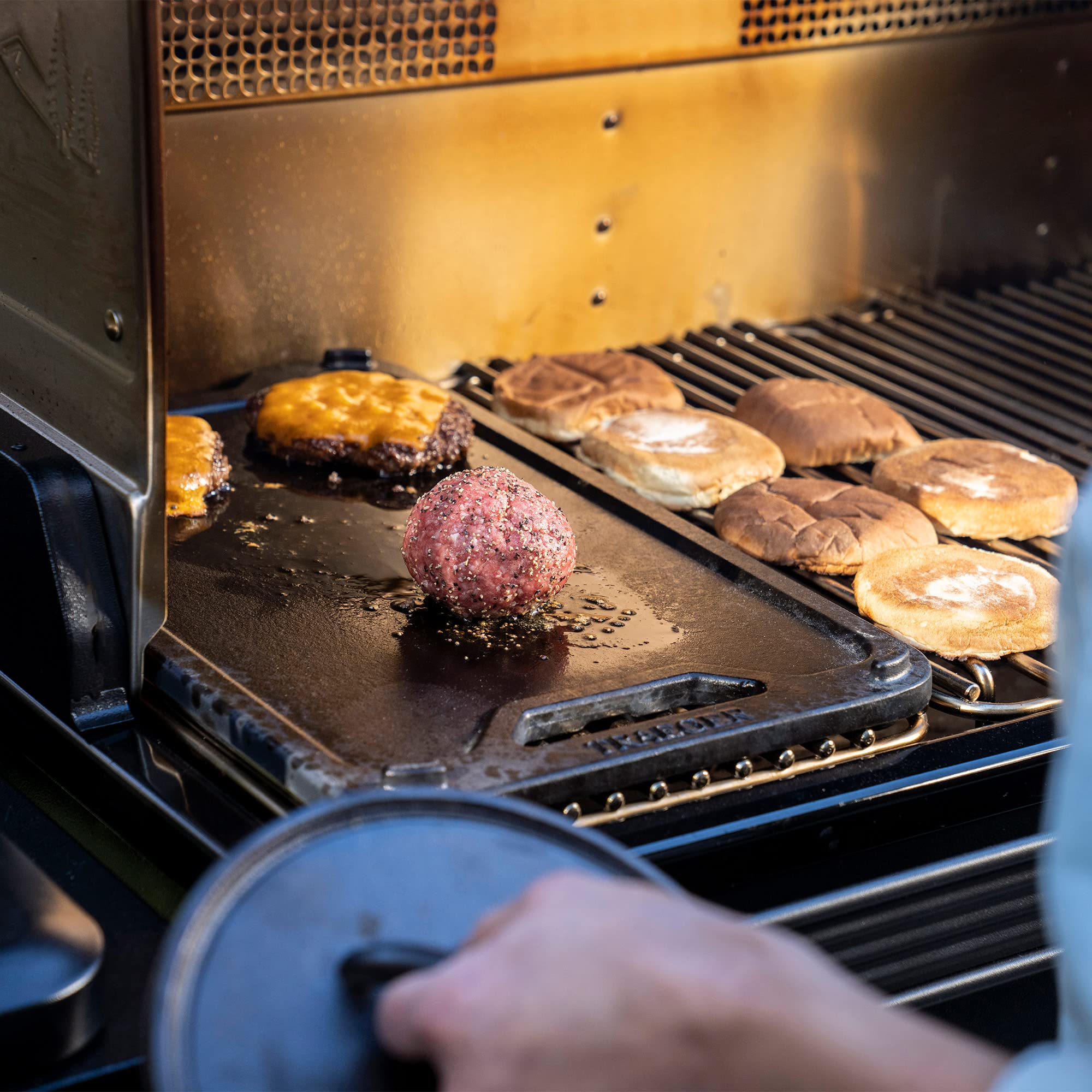 Traeger ModiFIRE griddle handle openings detail for safe placement and quick removal