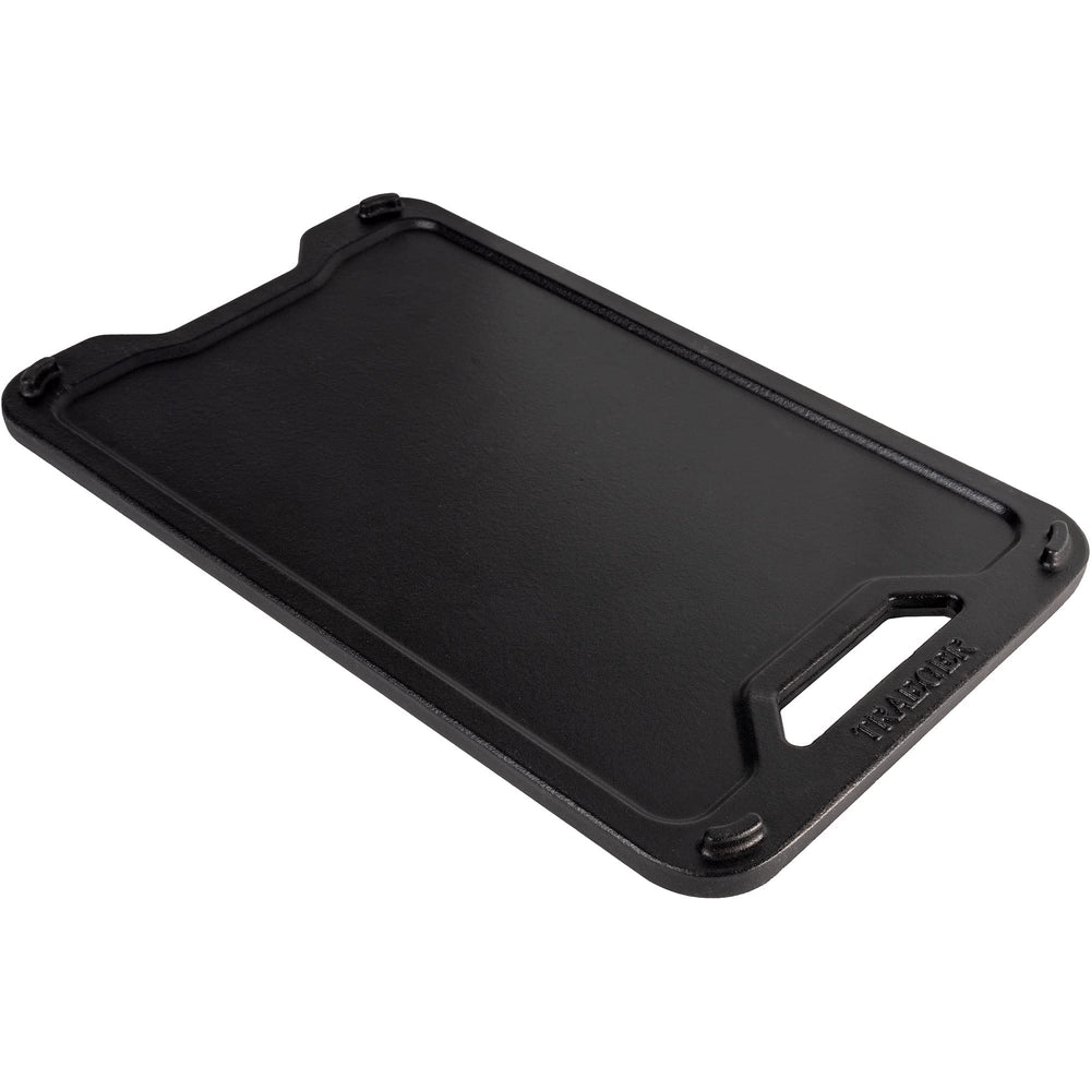 Traeger ModiFIRE griddle on grill grate for size comparison and stable cooking platform