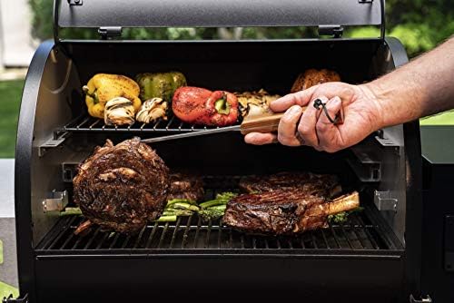Traeger pig tail length scale beside ruler showing 12-inch reach for safety