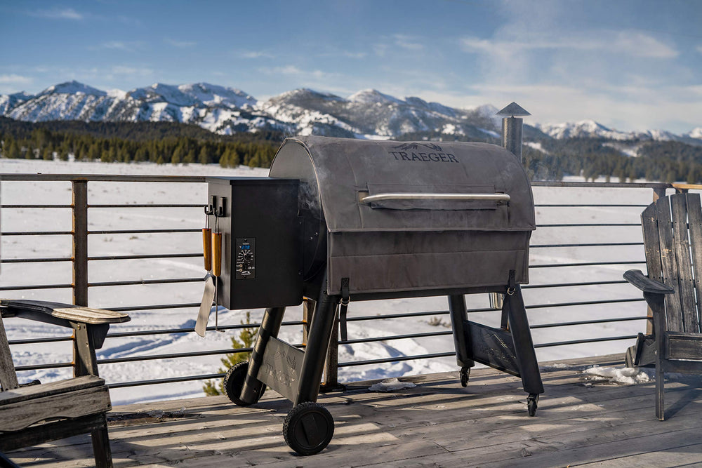Traeger Pro 34 with insulation blanket in snowy backyard highlighting consistent cooking