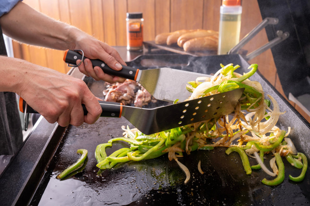 Traeger scraper edge closeup demonstrating strong cleaning and chopping benefit