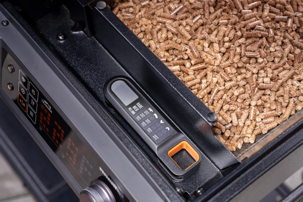 Traeger held in hand to show compact scale and ergonomic handling advantage
