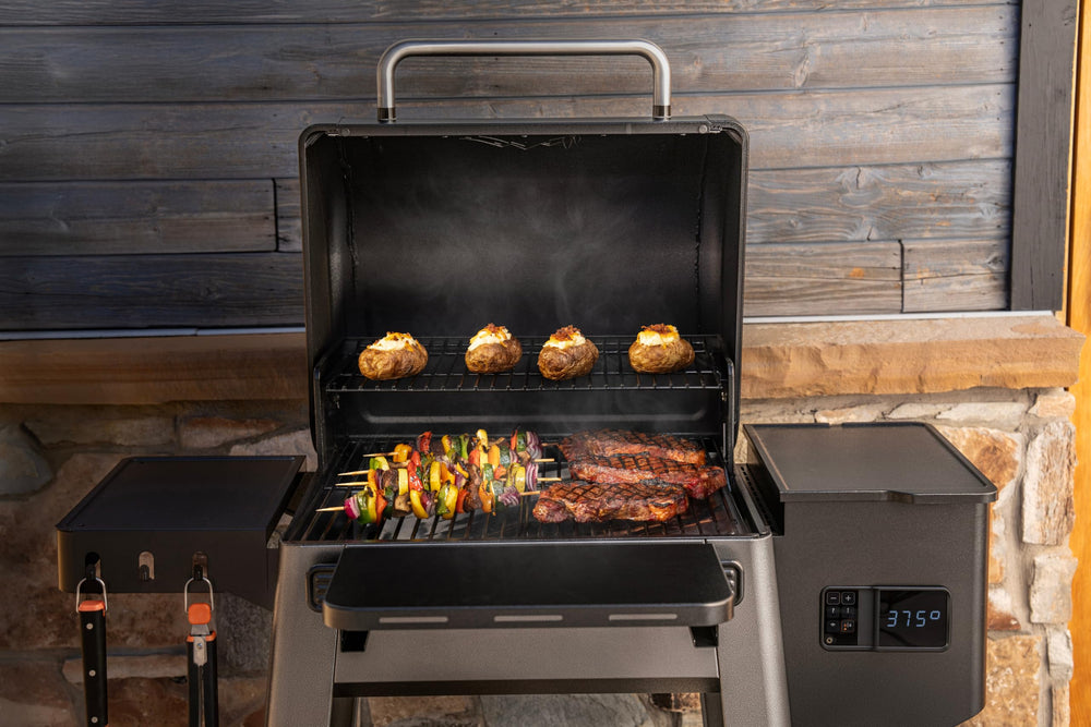 Traeger Westwood in backyard cookout setting showcasing family-style entertaining