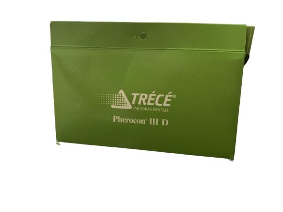 Trece trap size comparison on hand with hangers showing compact, easy-to-install design