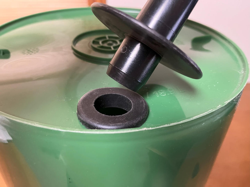 Tree I.V. installed in a used bucket demonstrating repurposing and cost savings
