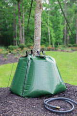treegator beside garden hose for scale showing easy filling and capacity