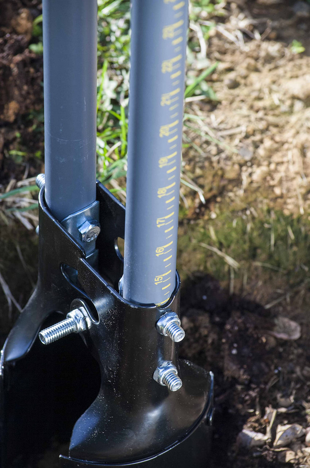 TRUE TEMPER beside tape measure showing 48-inch handle scale