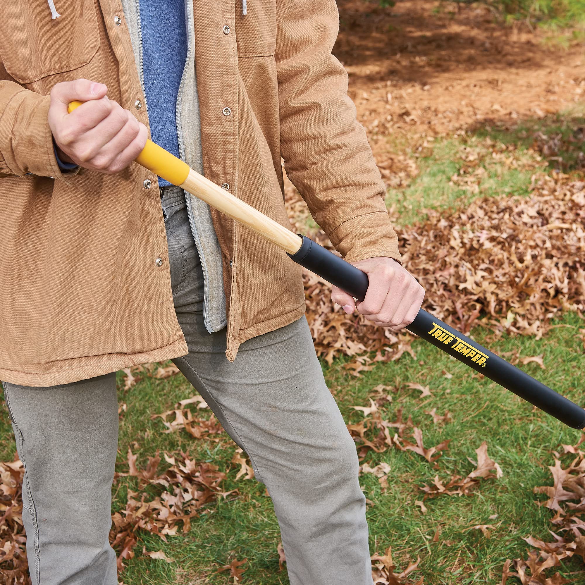 True Temper in use raking leaves demonstrating faster yard cleanup