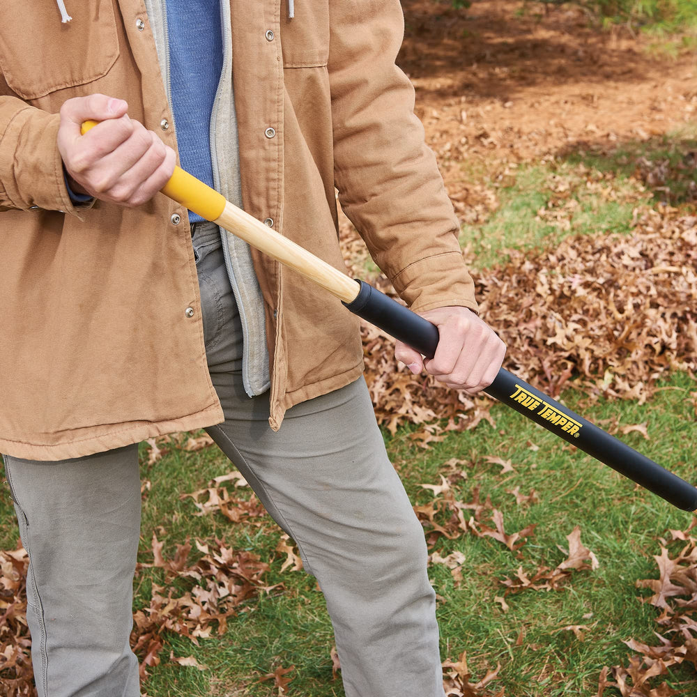 True Temper in use raking leaves demonstrating faster yard cleanup