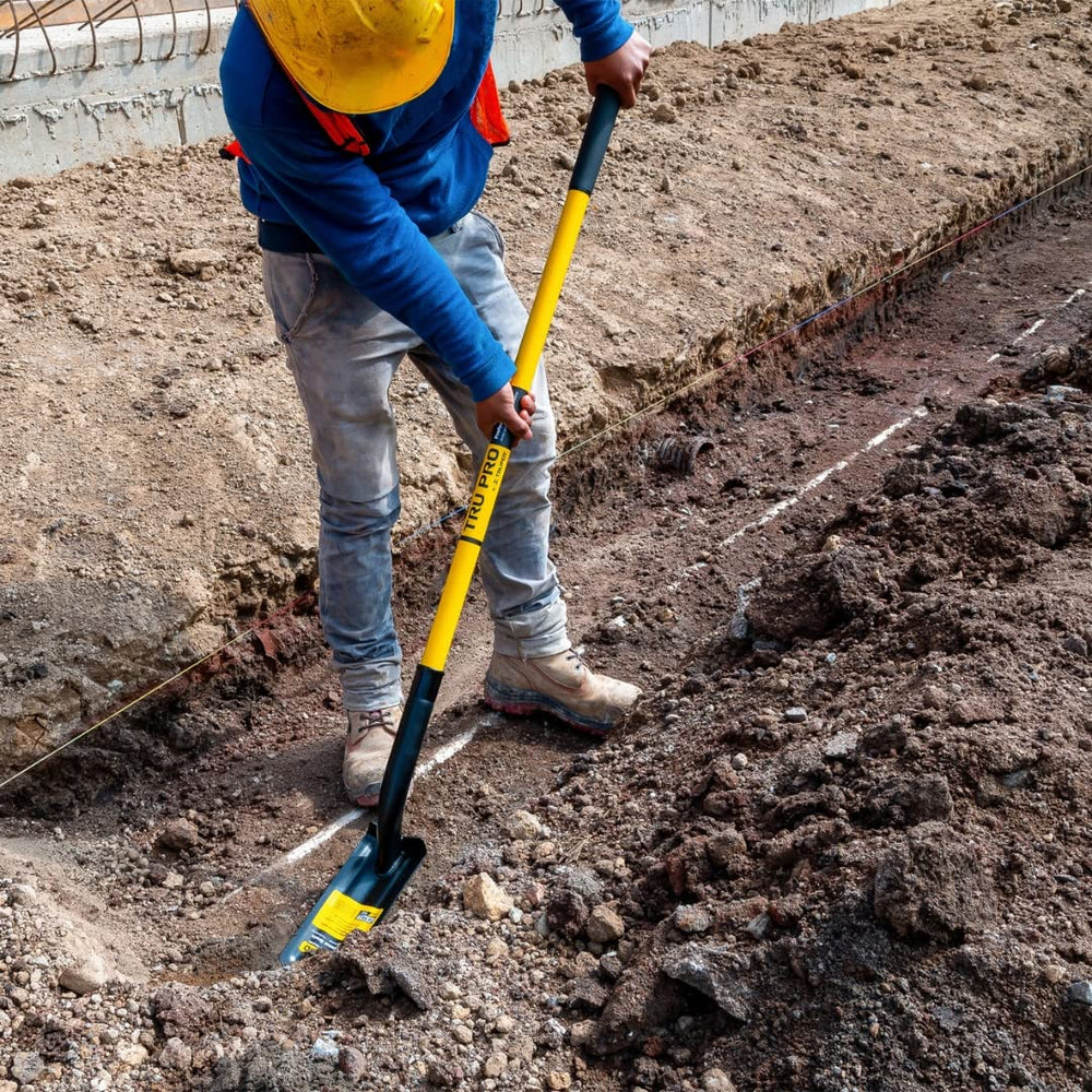 Truper TruPro shovel digging a narrow trench demonstrating precise cuts