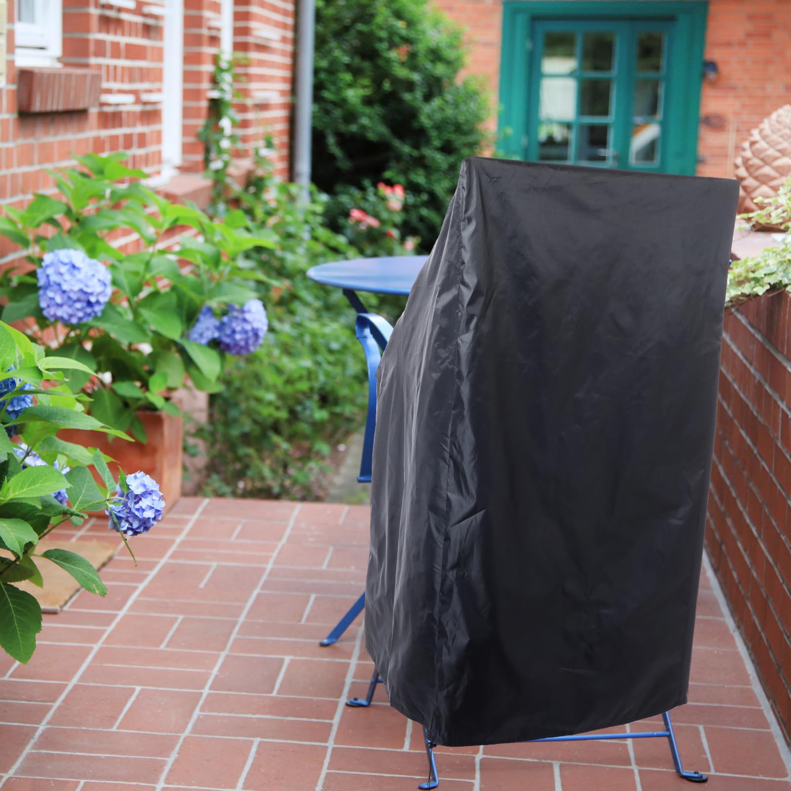 Tudomro covered stacked chairs outdoors showing full weather protection
