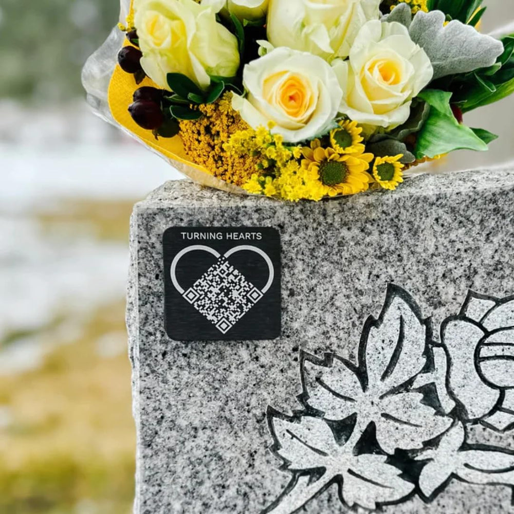 Turning Hearts medallion in a gravesite lifestyle scene offering accessible memorial