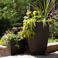 Tusco Products planter beside chair for scale showing easy portability benefit