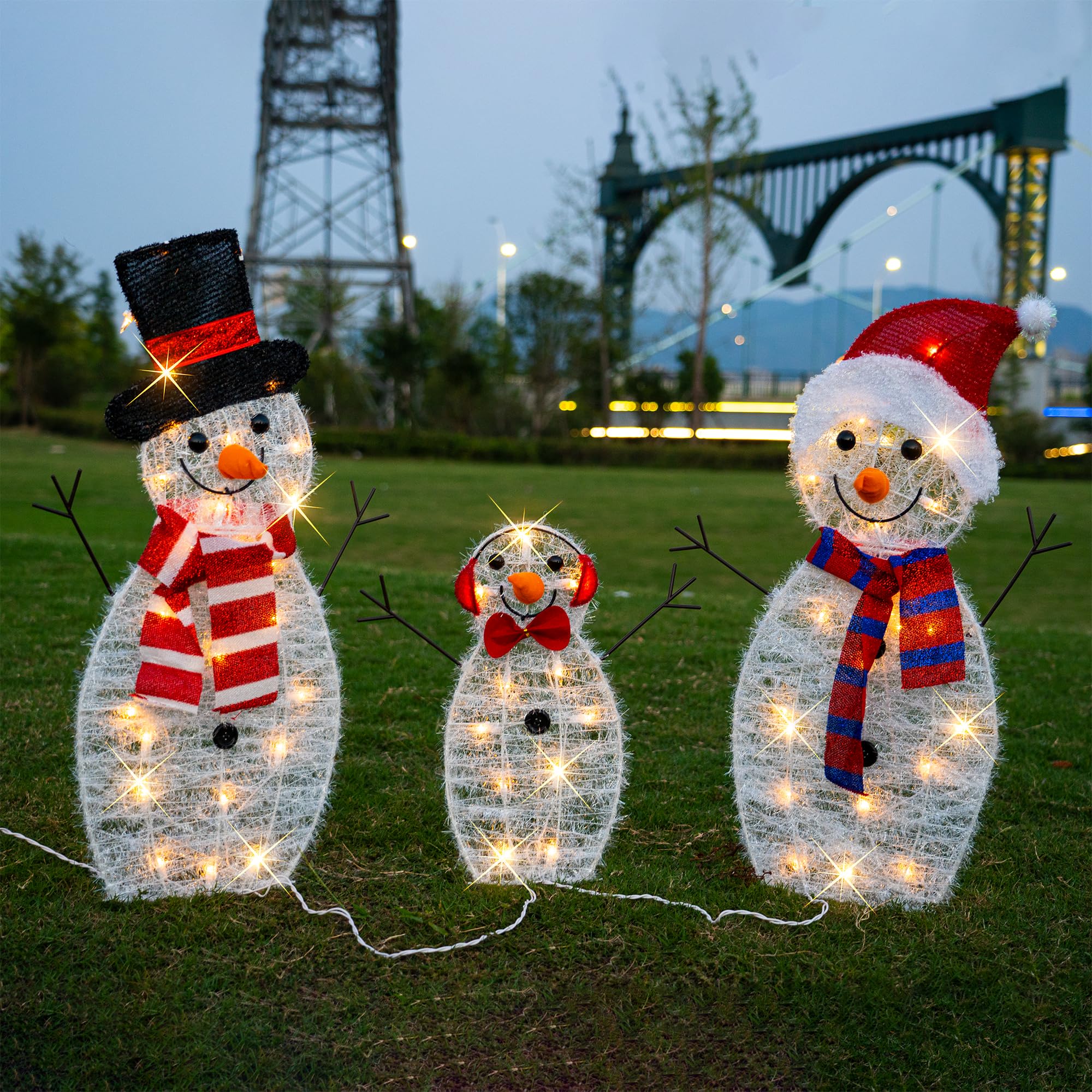 TW SHINE snowman next to garden stake showing scale and easy lawn installation