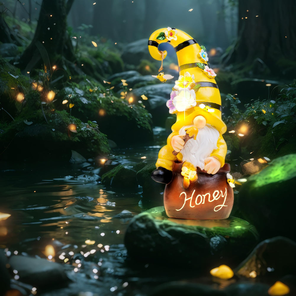twinbling gnome glowing at night highlighting illuminated bees and flowers